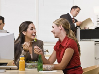 Businesswomen eating salad for lunch
