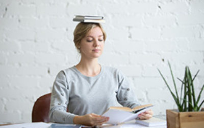 Woman Feeling Balanced At Her Office Desk