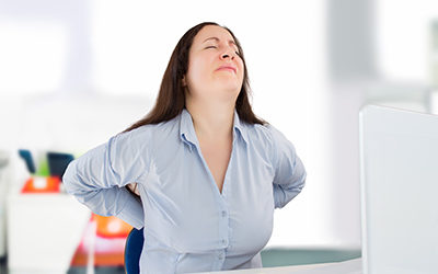 Woman-having-back-pain-at-work