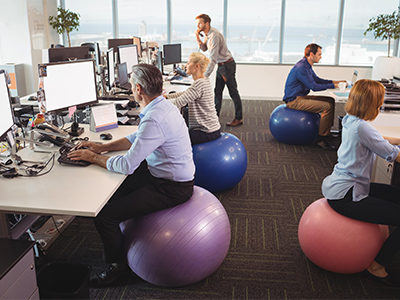 workers-sitting-on-exercise-balls